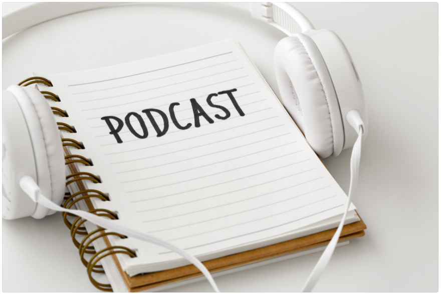 Podcast image with headphones over a notepad